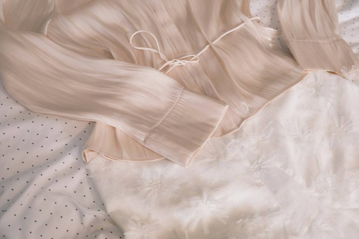 Side-by-side swatches showing true ivory vs. white vs. champagne veil fabrics under natural daylight